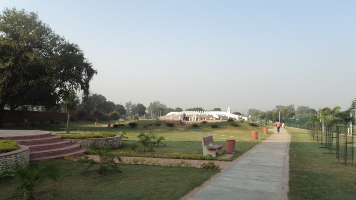 A view of The Garden of Palms ; towards the end you can see the white circular Chandigarh tourism building.